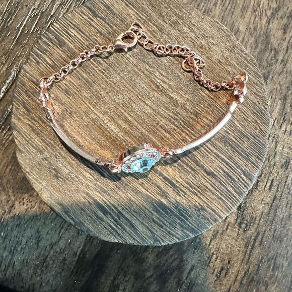NWT - Rose Gold Bracelet with Solitaire Center Smaller Gems along each side - Picture 2 of 4